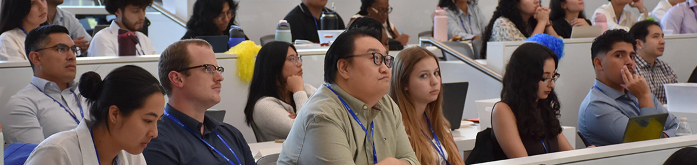 Students sitting in room 205 listening to a speaker