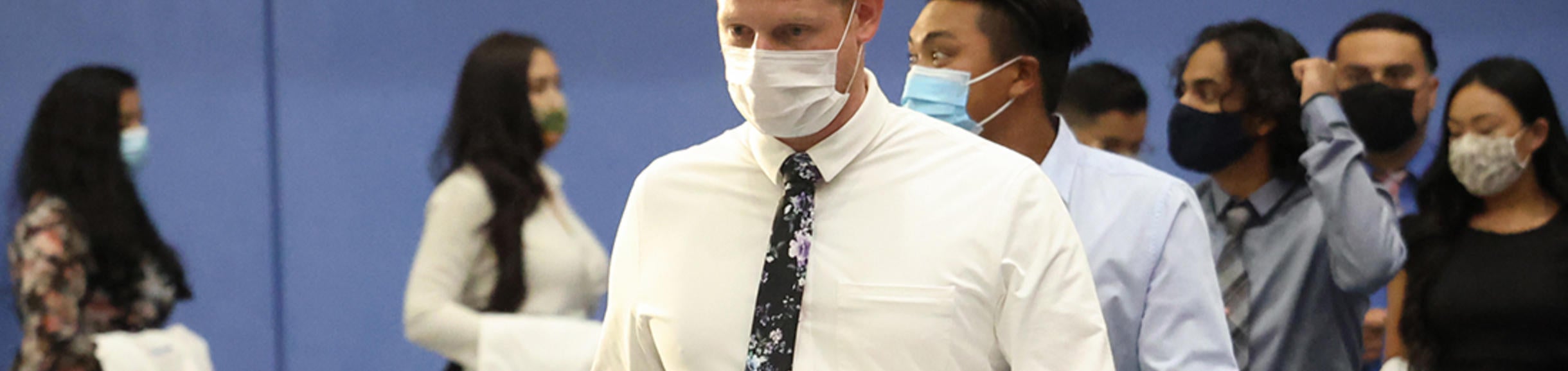 Students walking into white coat ceremony