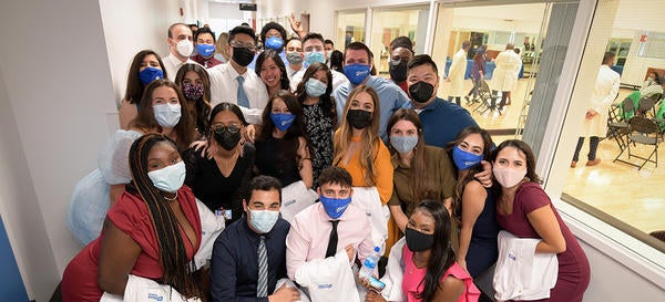 Group shot at white coat