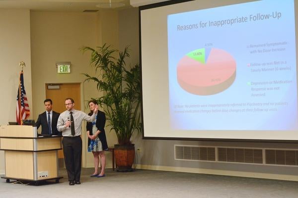 Students presenting at conference